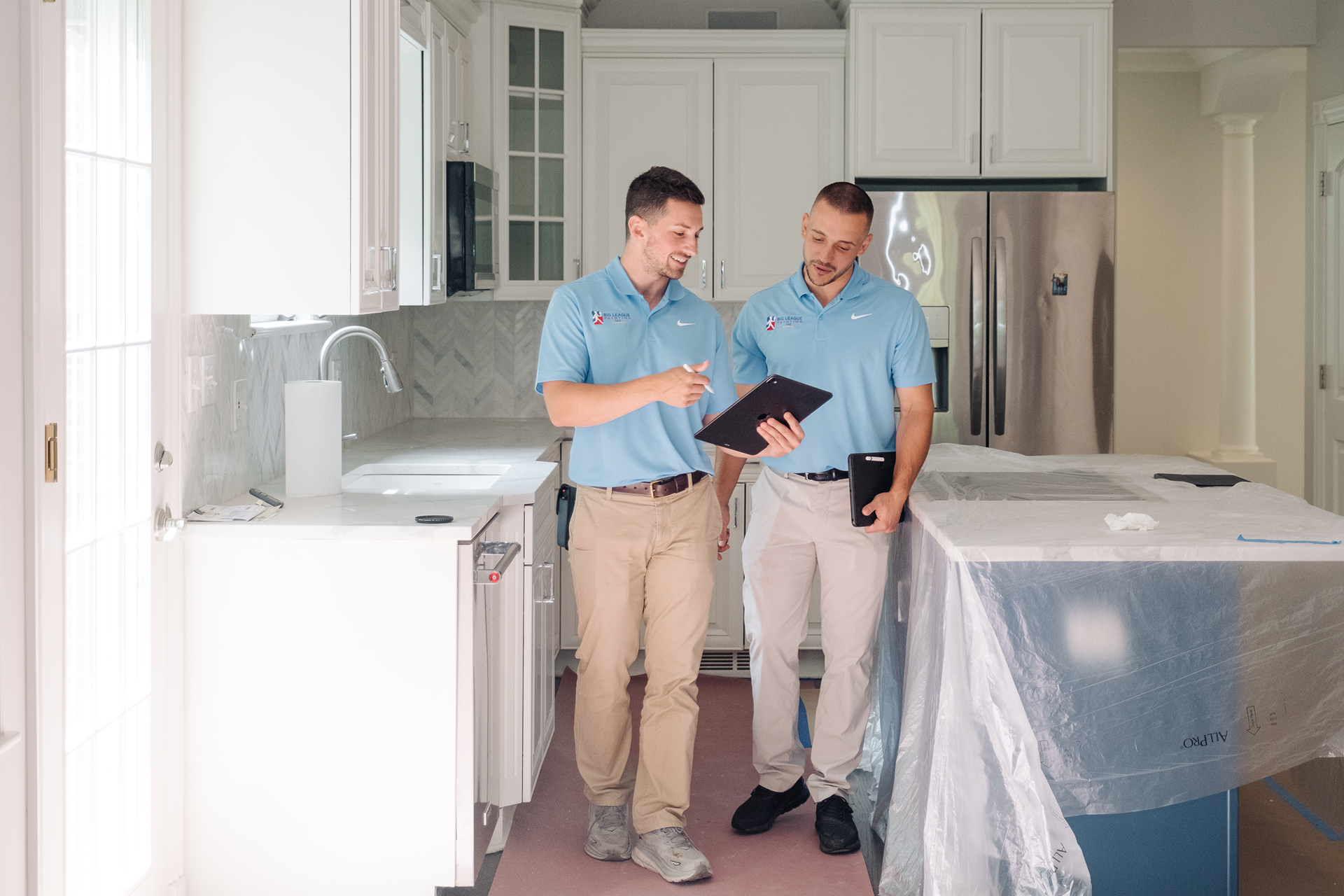 Skilled interior painters completing detailed interior painting work in a Glenview, IL home, focused on clean lines and a smooth, lasting finish.